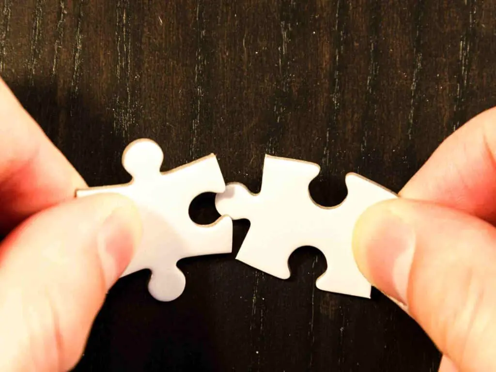 A symbolic image of two puzzles coming together to talk about the impact of matching donations as part of office Christmas charity