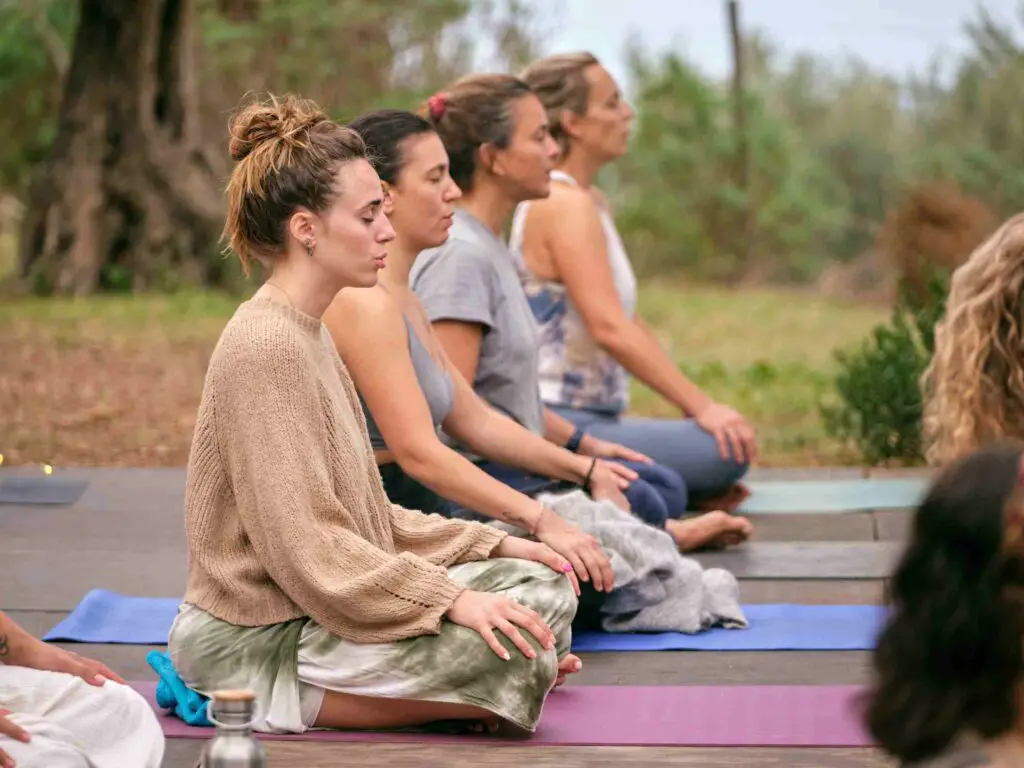 Participants at a yoga retreat as one of the yoga club fundraising ideas