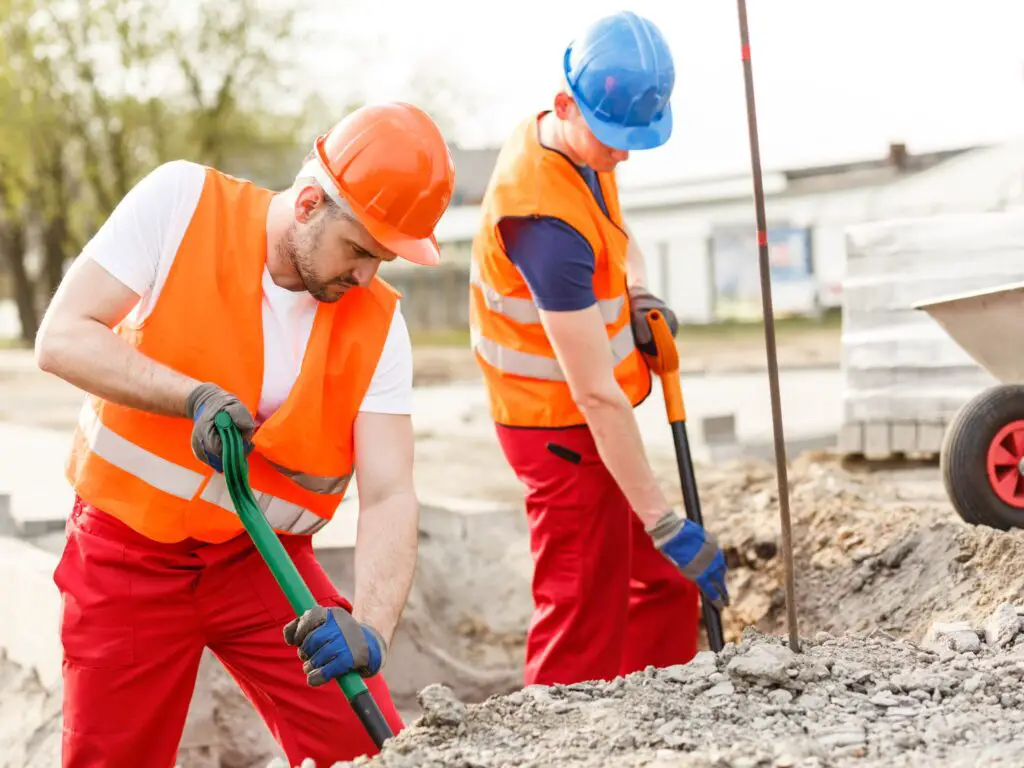 2 male construction workers working on site resembling labor day